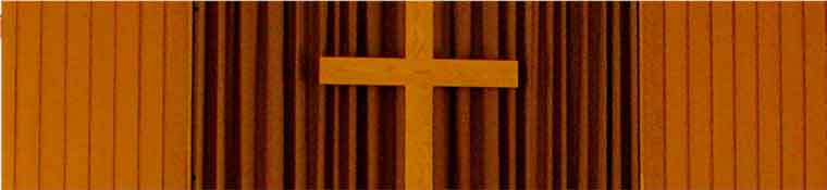 The wooden cross on the chancel wall in Alberton Church.